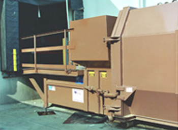 Stationary compactor with walk-on loading deck